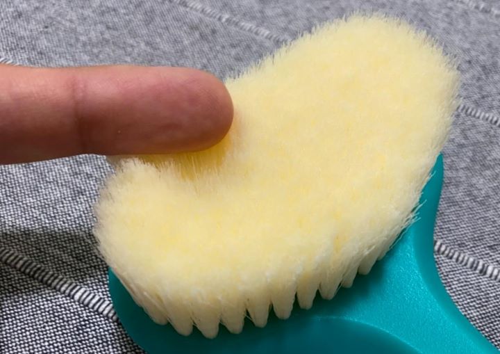 Confirming how soft the scrubbing bristles of the Greenrain back washer