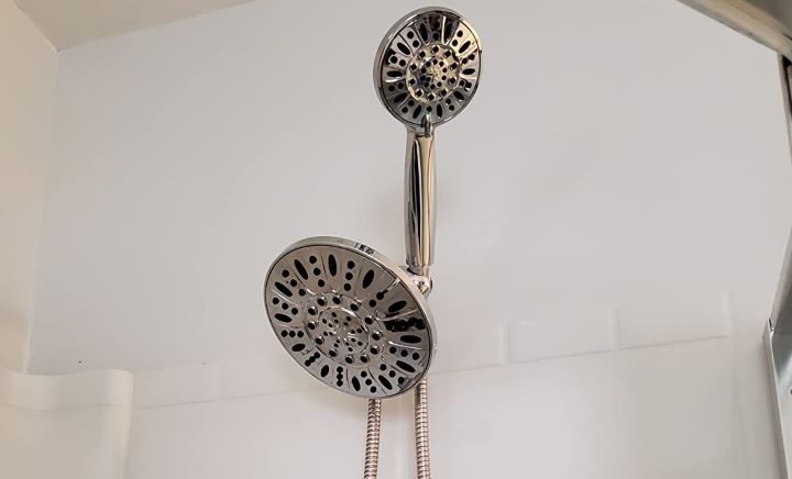 Inspecting how flexible the shower head with handheld combos