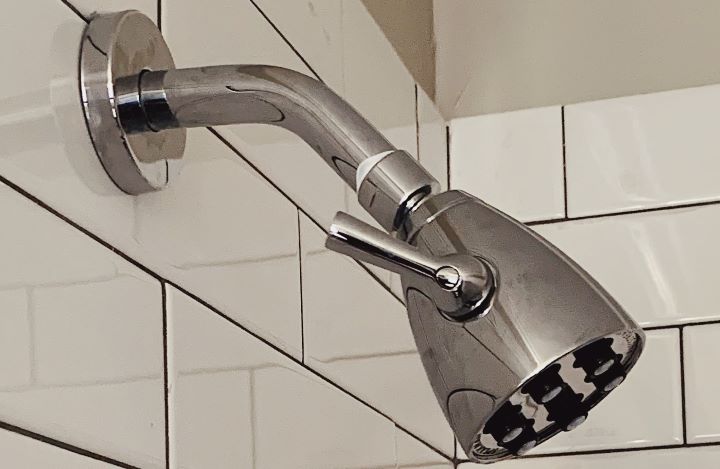 Using the adjustable pressure shower head from Speakman