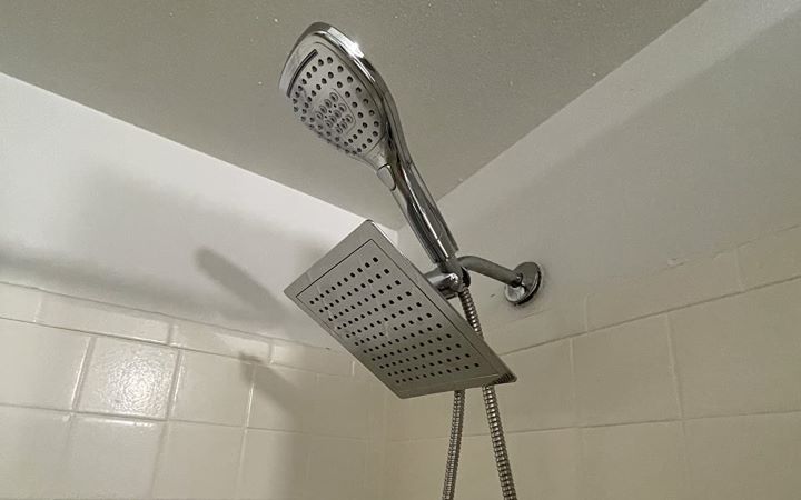 Using the lightweight DreamSpa's shower head with a handheld combo
