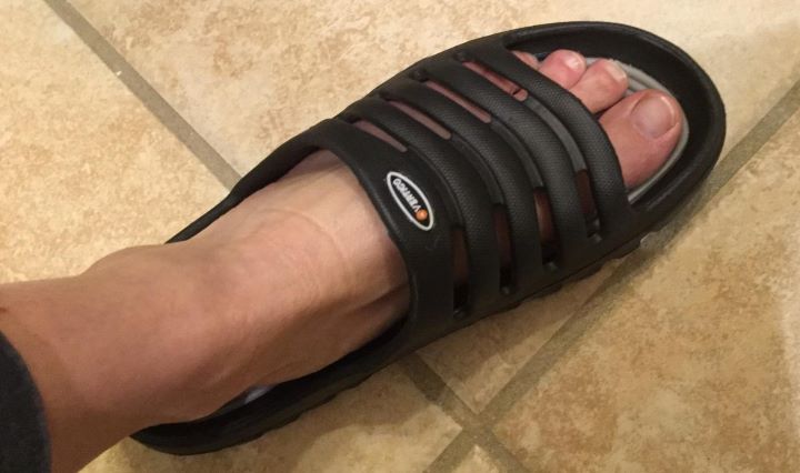 Wearing the slide-on Vertigo's shower sandal